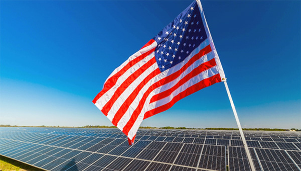 Solar panels behind the American Flag Solar panels behind the American Flag