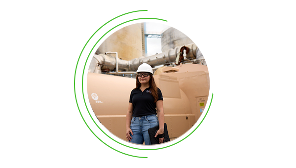 NextEra Energy engineer posing in front of a natural gas plant. NextEra Energy engineer posing in front of a natural gas plant.