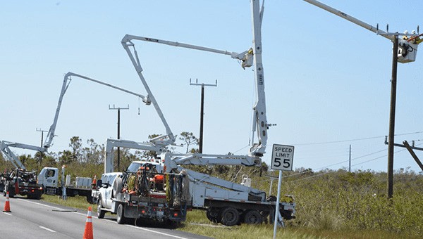 FPL trucks and employees doing linework repair